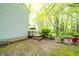 A view of the home's deck overlooking the spacious backyard, complete with patio furniture and lush trees at 1334 Legacy Ct, Indianapolis, IN 46234