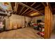 Spacious unfinished basement with exposed beams, concrete walls, and ample storage space with water heater at 1334 Legacy Ct, Indianapolis, IN 46234