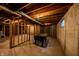 Unfinished basement with wood frame walls, foosball table and open ceiling, ready for your personal touch at 1334 Legacy Ct, Indianapolis, IN 46234