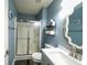 Bathroom featuring a shower with glass doors, modern vanity, and fixtures at 1334 Legacy Ct, Indianapolis, IN 46234