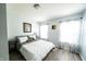 Bright bedroom with natural light, neutral walls, wood floor, and coordinated decor at 1334 Legacy Ct, Indianapolis, IN 46234