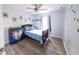 Charming bedroom with a cozy bed, whimsical decor, and a ceiling fan for added comfort at 1334 Legacy Ct, Indianapolis, IN 46234