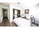 Inviting bedroom with neutral decor, plush bedding, built in closet and wood floors at 1334 Legacy Ct, Indianapolis, IN 46234