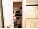 Well-organized closet featuring shelving, towels, cleaning products, and toiletries at 1334 Legacy Ct, Indianapolis, IN 46234