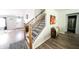 Welcoming entryway with wood floors, decorative rug, and staircase at 1334 Legacy Ct, Indianapolis, IN 46234
