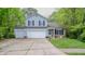 Charming two-story home with a well-manicured lawn, a two-car garage, and classic curb appeal at 1334 Legacy Ct, Indianapolis, IN 46234