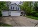 Charming two-story home with a two car garage, brick accents, and long driveway at 1334 Legacy Ct, Indianapolis, IN 46234