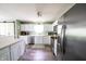 Well-equipped kitchen featuring stainless steel appliances, white cabinetry, and a convenient layout at 1334 Legacy Ct, Indianapolis, IN 46234