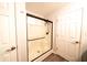 Modern shower featuring a black frame, glass doors, and a sleek shower head at 1334 Legacy Ct, Indianapolis, IN 46234