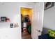 Bright walk-in closet with shelving, hanging racks, and ample storage space with door ajar at 1334 Legacy Ct, Indianapolis, IN 46234