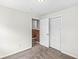 Bedroom with neutral carpet, white walls, closet, and doorway at 1391 N Shadeland Ave, Indianapolis, IN 46219