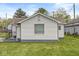 Well-maintained single-story home with white siding and a cozy, welcoming appearance at 1391 N Shadeland Ave, Indianapolis, IN 46219