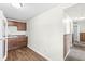 Bright kitchen with dark wood cabinets and laminate countertops against a white wall at 1391 N Shadeland Ave, Indianapolis, IN 46219