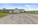Single-story home with ample parking space and convenient side access, blending functionality and charm at 1391 N Shadeland Ave, Indianapolis, IN 46219