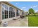 An outdoor patio area features sliding glass doors and patio seating at 14018 Powder Dr, Carmel, IN 46033
