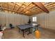 Unfinished basement with ping pong table, ready for customization and recreation at 14018 Powder Dr, Carmel, IN 46033