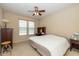 Comfortable bedroom with natural light, ceiling fan, and cozy furnishings at 14018 Powder Dr, Carmel, IN 46033