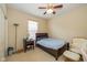 Classic bedroom with neutral carpet, ceiling fan, and comfortable single bed at 14018 Powder Dr, Carmel, IN 46033