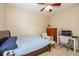 Guest bedroom with lots of natural light, carpeted floor, a ceiling fan and office space at 14018 Powder Dr, Carmel, IN 46033