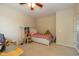 Cozy bedroom with carpet flooring, neutral walls, and a ceiling fan at 14018 Powder Dr, Carmel, IN 46033