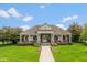 A welcoming community clubhouse features a brick facade, well-manicured lawn, and sidewalks at 14018 Powder Dr, Carmel, IN 46033