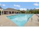 The community pool area includes many lounge chairs and a covered picnic area at 14018 Powder Dr, Carmel, IN 46033