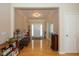 Grand foyer with hardwood floors, natural light, and neutral color scheme at 14018 Powder Dr, Carmel, IN 46033