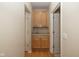 Hallway featuring a built-in cabinet with countertop and additional storage space at 14018 Powder Dr, Carmel, IN 46033
