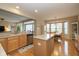 Spacious kitchen that opens to dining area, featuring wood cabinetry and stainless steel appliances at 14018 Powder Dr, Carmel, IN 46033