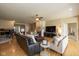 Open-concept living room with hardwood floors, comfortable seating, and a fireplace at 14018 Powder Dr, Carmel, IN 46033
