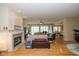 Spacious living room with hardwood floors, fireplace, and open floor plan at 14018 Powder Dr, Carmel, IN 46033