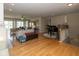 Open-concept living room featuring hardwood floors, natural light, and a grand piano at 14018 Powder Dr, Carmel, IN 46033