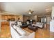 Bright and airy living room featuring hardwood floors, open to the kitchen, and comfortable seating at 14018 Powder Dr, Carmel, IN 46033