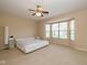Spacious main bedroom with a modern bed frame, a ceiling fan, and a bright bay window at 14018 Powder Dr, Carmel, IN 46033