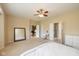 Spacious main bedroom featuring neutral walls, ceiling fan, and en suite bathroom access at 14018 Powder Dr, Carmel, IN 46033