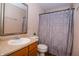 Cozy bathroom featuring a vanity with a framed mirror and a shower with patterned curtain at 1404 Norton Dr, Greenwood, IN 46143