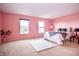 Bright bedroom with soft carpet and two windows, offering ample natural light at 1404 Norton Dr, Greenwood, IN 46143