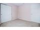 Neutral bedroom with two closets and a closed door at 1404 Norton Dr, Greenwood, IN 46143