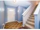 Inviting foyer features a staircase and an elegant front door with glass detailing at 1404 Norton Dr, Greenwood, IN 46143