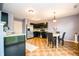 The kitchen features stainless steel appliances, black cabinetry, and dining area at 1404 Norton Dr, Greenwood, IN 46143