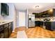 Spacious kitchen featuring stainless steel appliances and dark cabinetry at 1404 Norton Dr, Greenwood, IN 46143