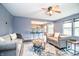 Comfortable living room with a ceiling fan, an open bar, and a cozy atmosphere at 1404 Norton Dr, Greenwood, IN 46143