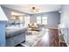 Spacious living room with hardwood floors, modern furnishings, and abundant natural light at 1404 Norton Dr, Greenwood, IN 46143