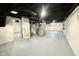 Spacious unfinished basement with exposed ceiling, painted walls and floor with utility access at 1601 E Edwards Ave, Indianapolis, IN 46227