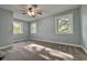 Cozy bedroom featuring a large window offering abundant natural light and plush carpet at 1601 E Edwards Ave, Indianapolis, IN 46227