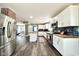 Bright kitchen with white cabinets, stainless steel appliances, and a convenient island at 1601 E Edwards Ave, Indianapolis, IN 46227
