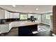Modern kitchen with white cabinets, butcher block countertops, and stainless steel appliances at 1601 E Edwards Ave, Indianapolis, IN 46227