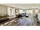Spacious living room with modern furniture, wood floors and plenty of natural light at 1601 E Edwards Ave, Indianapolis, IN 46227