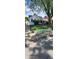 Charming single-Gathering home with black and white striped awnings and an overgrown front lawn at 1632 W 8Th W St, Anderson, IN 46016