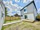 A modern style home's backyard with a wooden deck, yard, and fence at 1721 Thaddeus St, Indianapolis, IN 46203